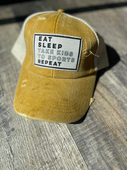 EAT SLEEP TAKE KIDS TO SPORTS CRISS-CROSS PONYTAIL HAT